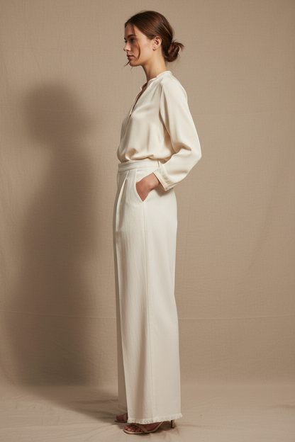Model side view – wide-leg silhouette and pleat drape from side