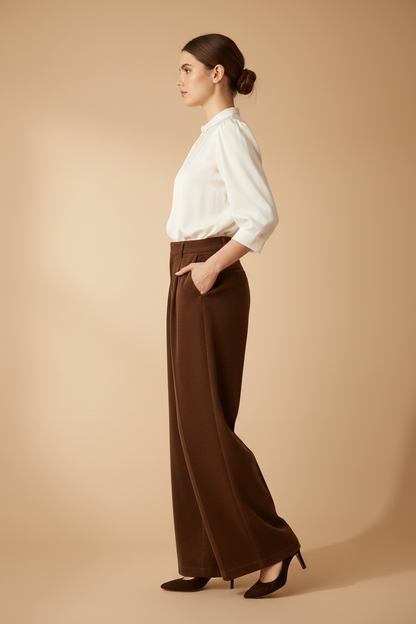 Model side view – wide-leg drape and pleat silhouette from side