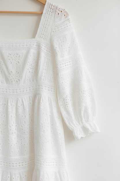 Front view 2 – close-up square neckline, eyelet bodice and puff sleeve cuff